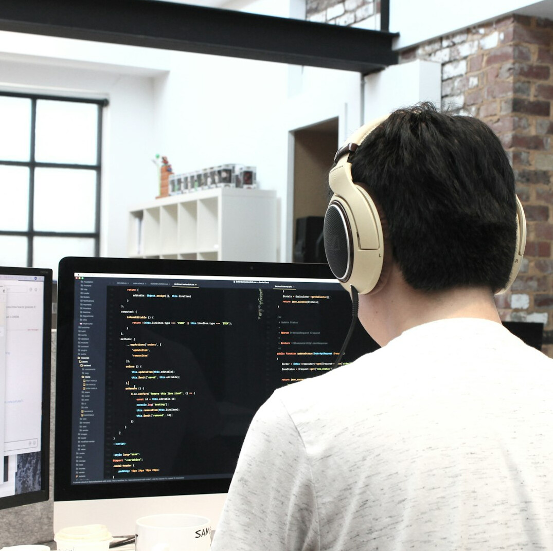 programmer at desk coding