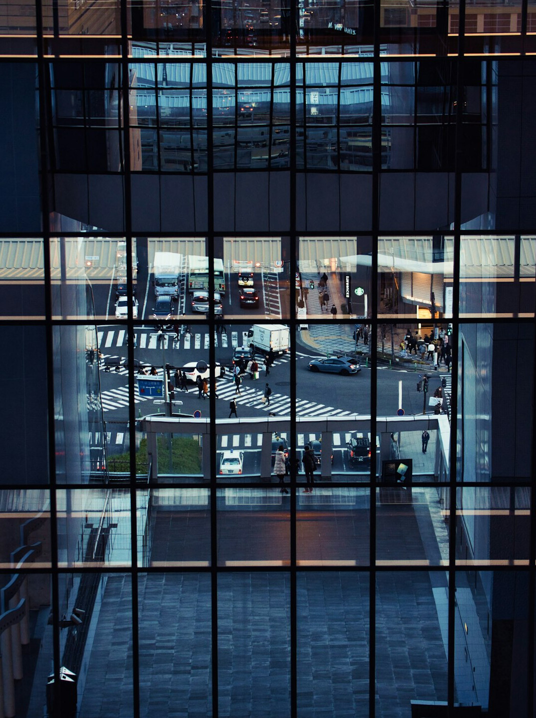 Wide view of a modern technology office with glass walls